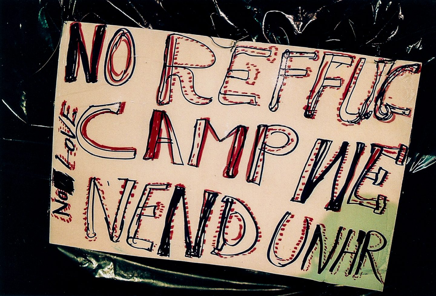 Sign made by victims of xenophobia and worried African expats outside the Cape Town central police station, 2018.