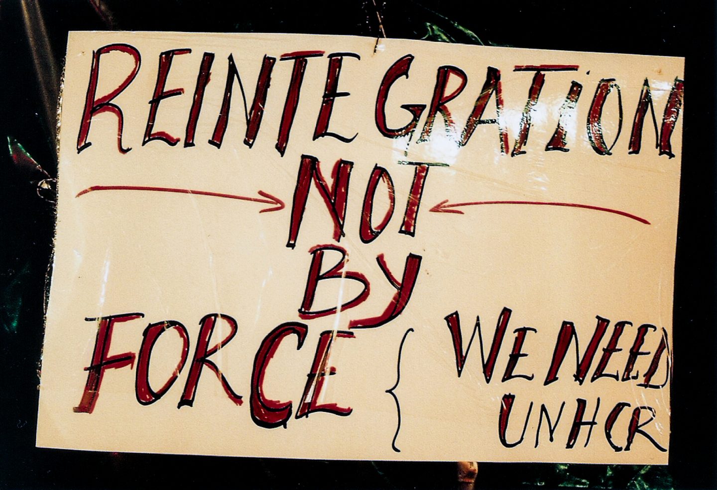 Sign made by victims of xenophobia and worried African expats outside the Cape Town central police station, 2018.
