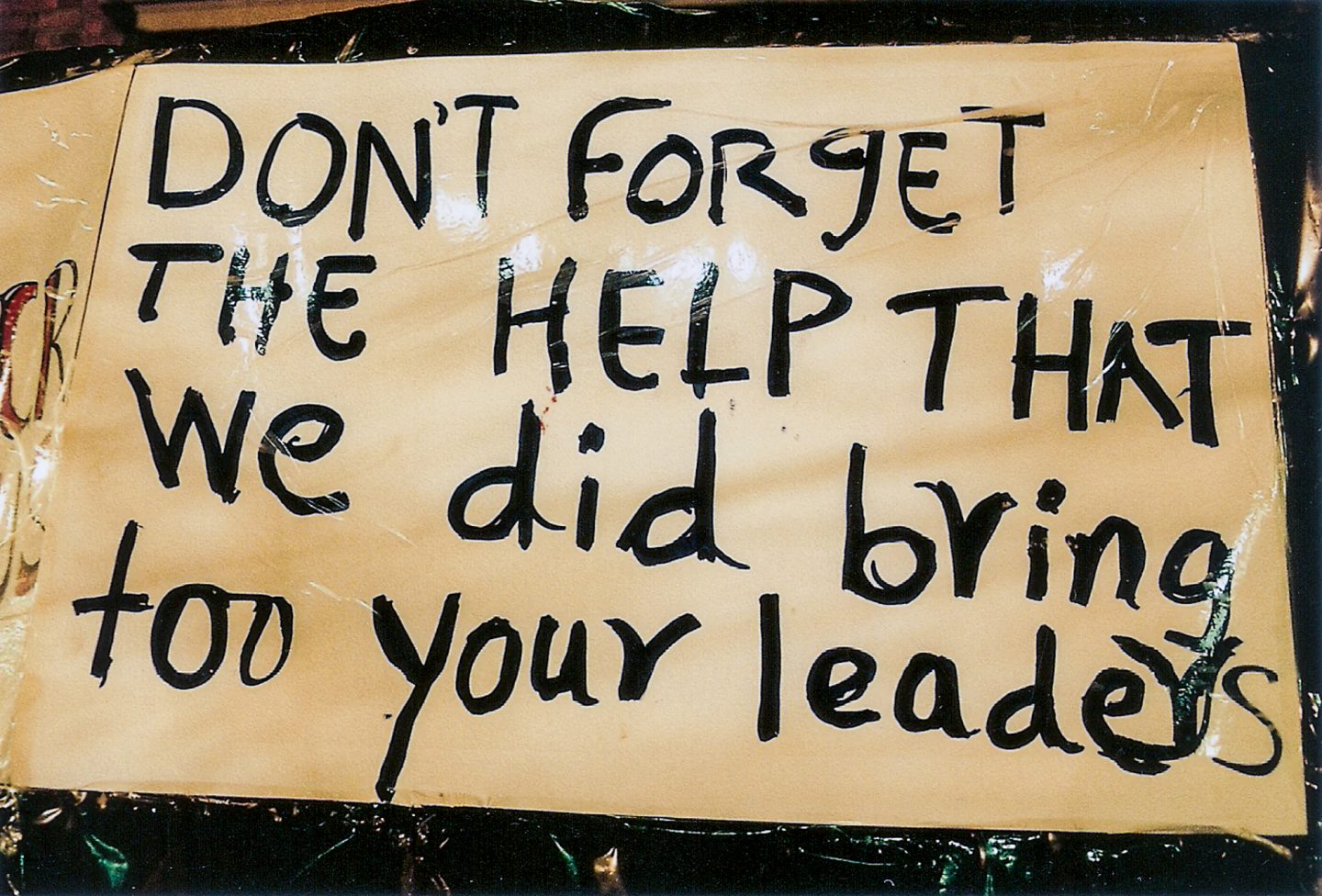 Sign made by victims of xenophobia and worried African expats outside the Cape Town central police station, 2018.